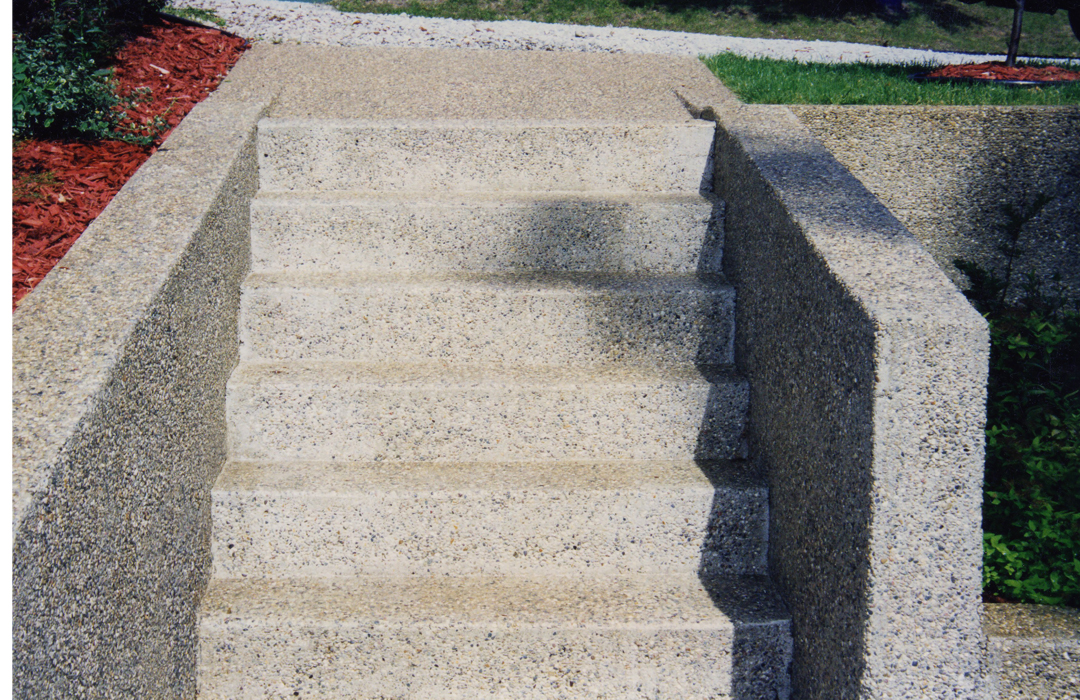 Custom exposed aggregate concrete steps and hardscape design